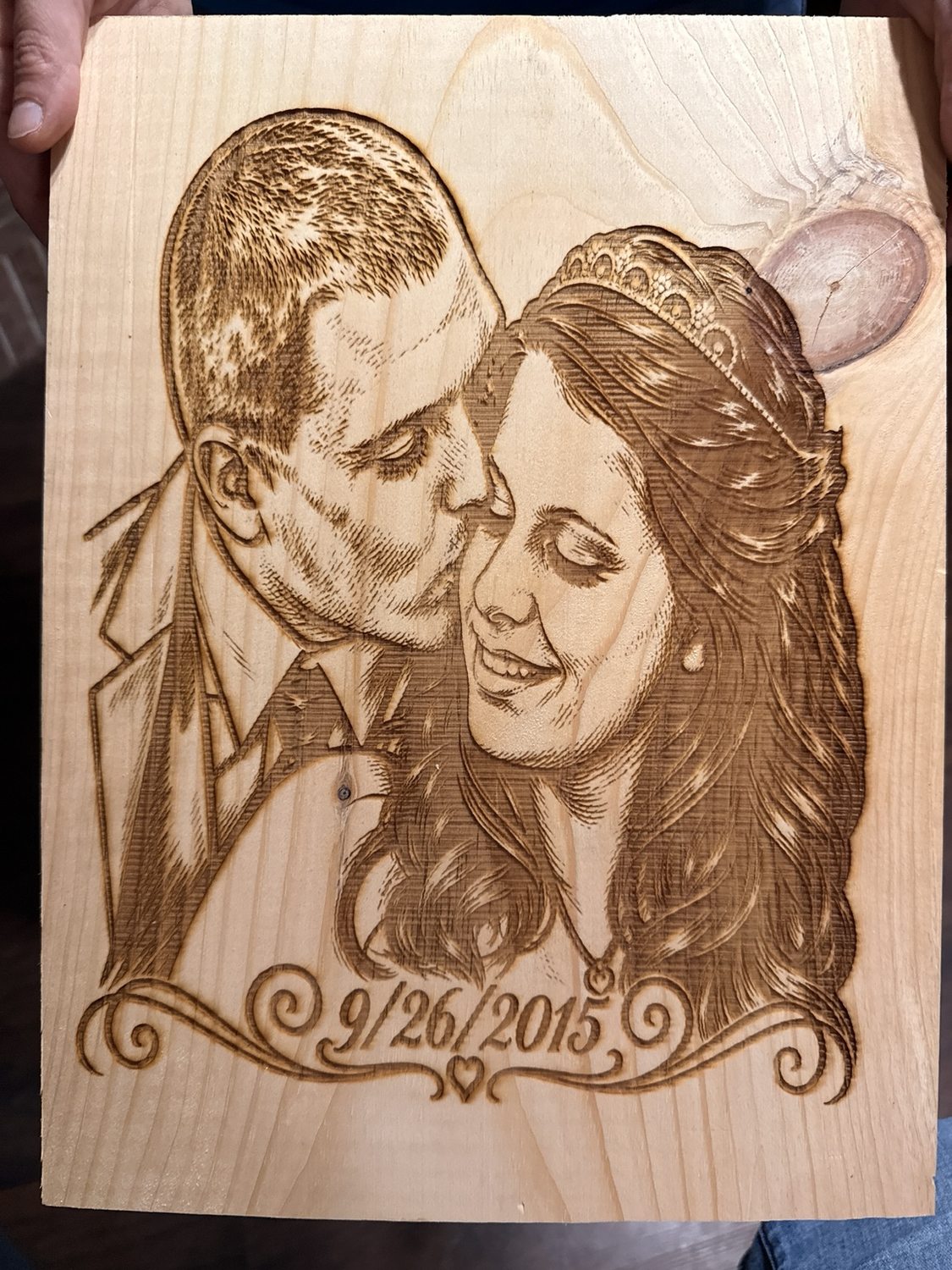 Custom engraved portrait of a couple on a wooden plaque