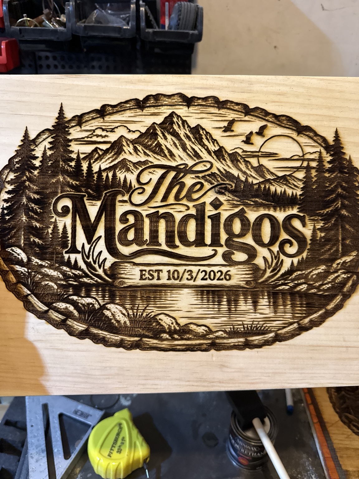 The Mandigos family mountain and lake sign, established October 3, 2026